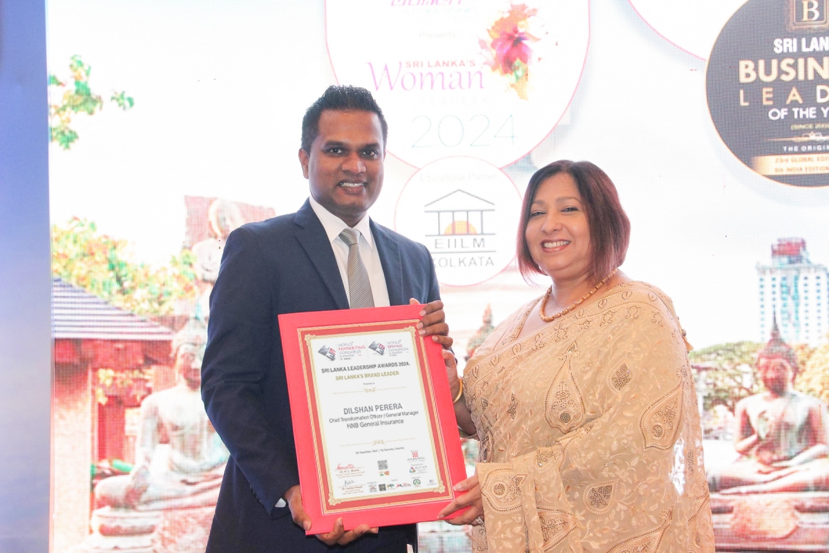 Image : Dilshan Perera receiving the award from Mrs. Sandra De Zoysa, Group Chief Customer Officer of Dialog Axiata PLC.