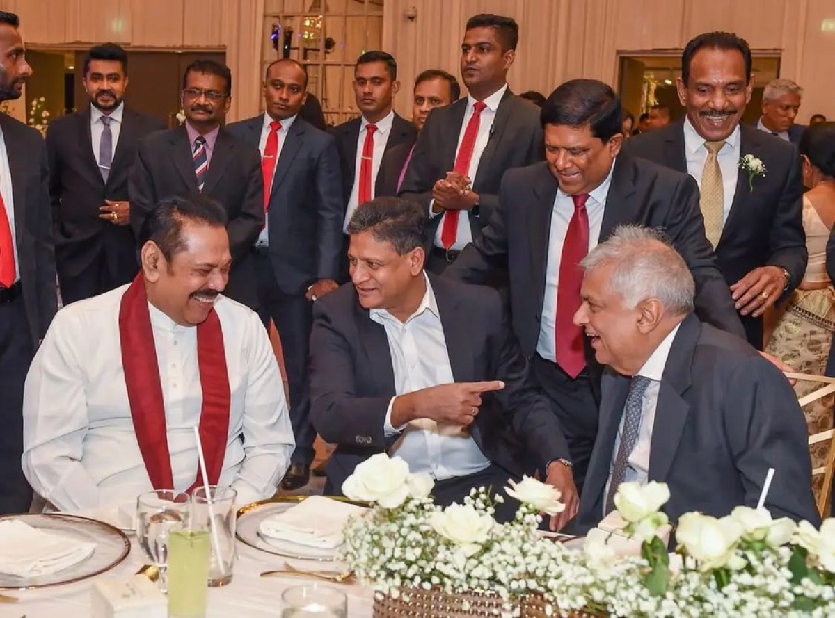 Strange Bedfellows:  President Wickremesinghe, Rajapaksa, Abeywardena, and Jayaweera Share Laughter at Colombo Wedding